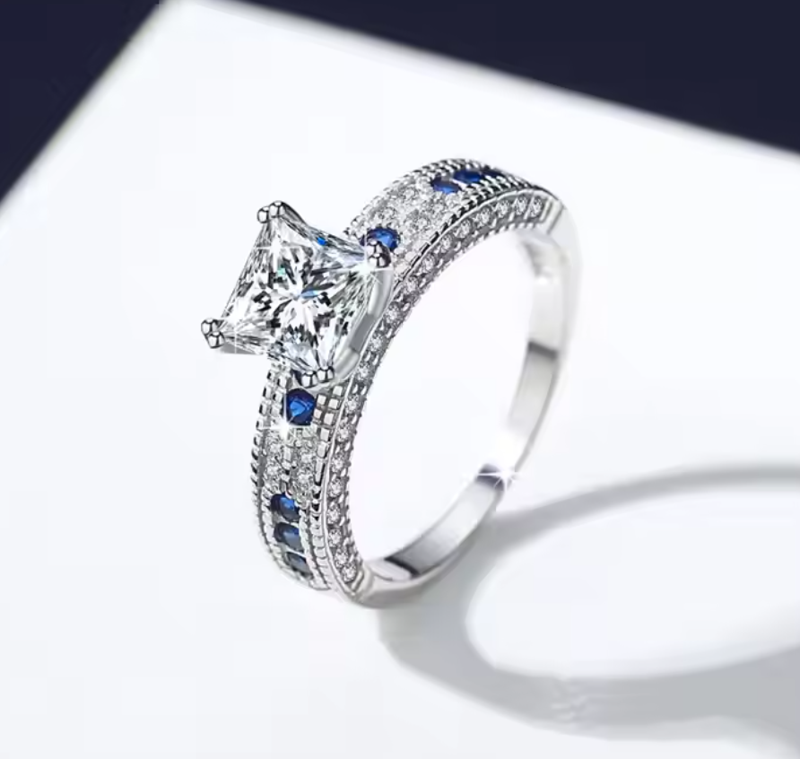 Royal Sapphire: 1.2 Carat Princess Cut Moissanite Ring with Sapphire-Like Accents